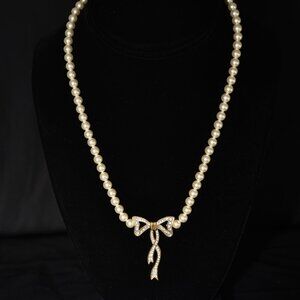 1960's Faux Pearl Necklace With A Rhinestone Gold Tone Bow & Box Clasp